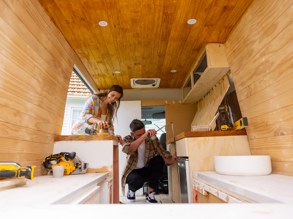 Bri and partner working on their Van renovation